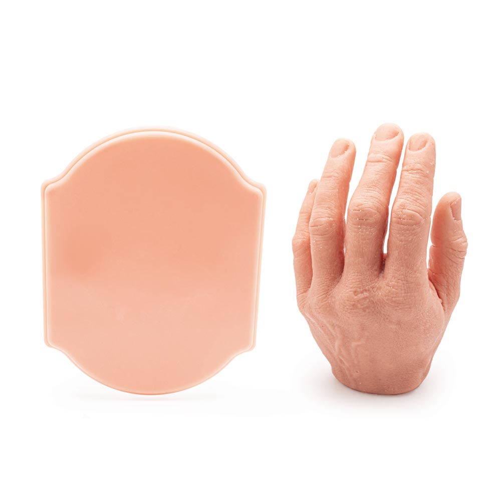 A Pound of Flesh Micro Series Tattooable Synthetic Small Plaque (with hand for scale)