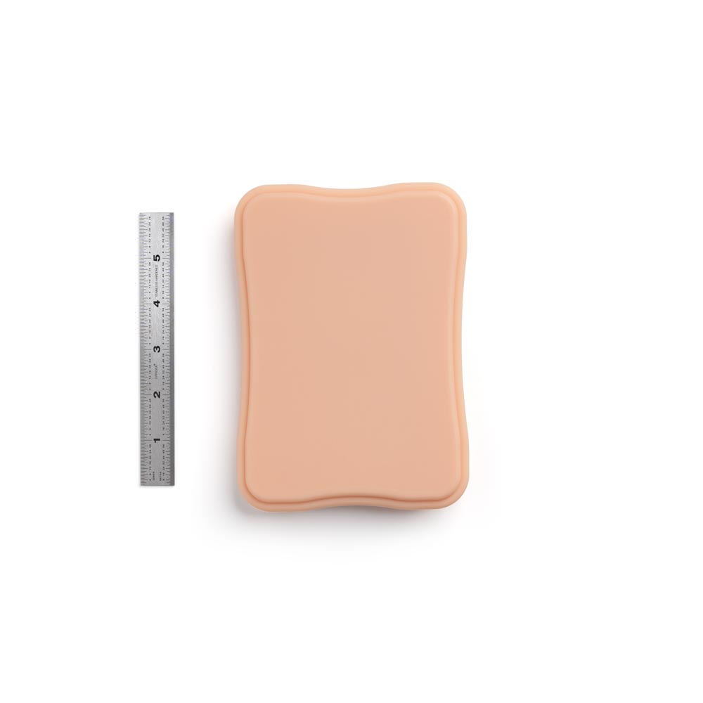 A Pound of Flesh Micro Series Tattooable Synthetic Small Square Plaque in Fitzpatrick Tone 2 shown with ruler for scale