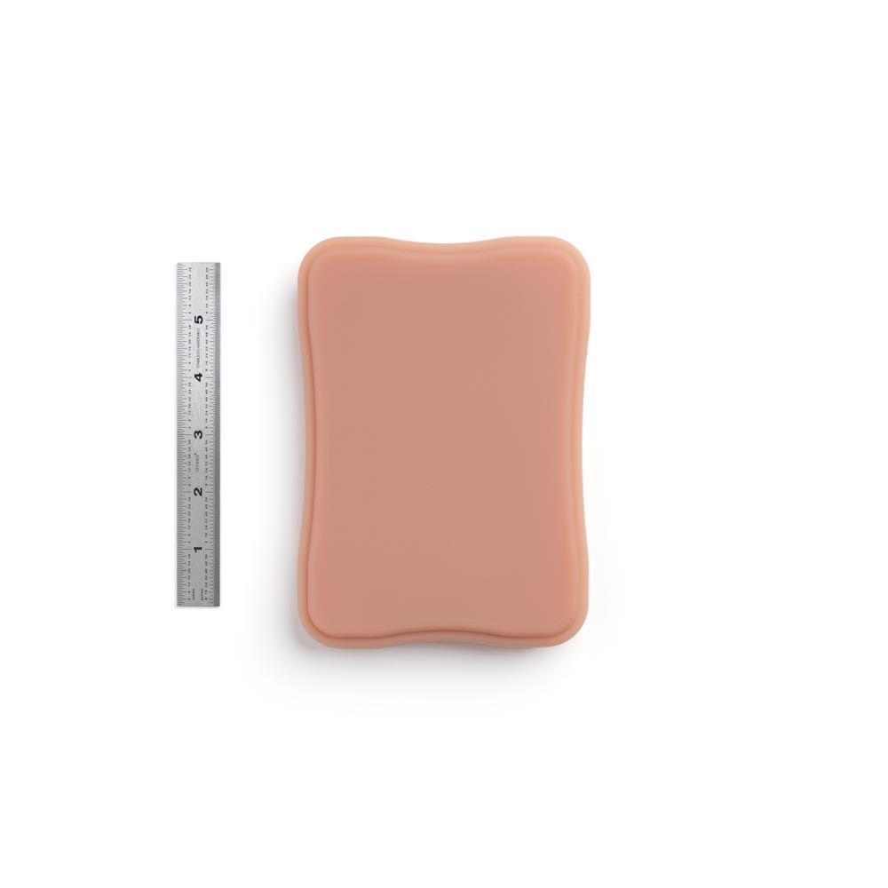 A Pound of Flesh Micro Series Tattooable Synthetic Small Square Plaque in Fitzpatrick Tone 3 shown with six inch ruler for scale