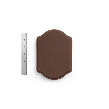 A Pound of Flesh Micro Series Tattooable Synthetic Small Plaque in Fitzpatrick Tone 5 shown with six inch ruler for scale