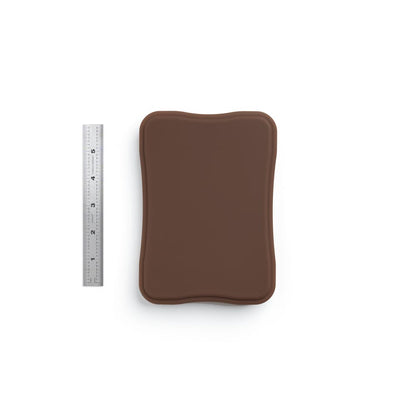 A Pound of Flesh Micro Series Tattooable Synthetic Small Square Plaque in Fitzpatrick Tone 5 shown with six inch ruler for scale