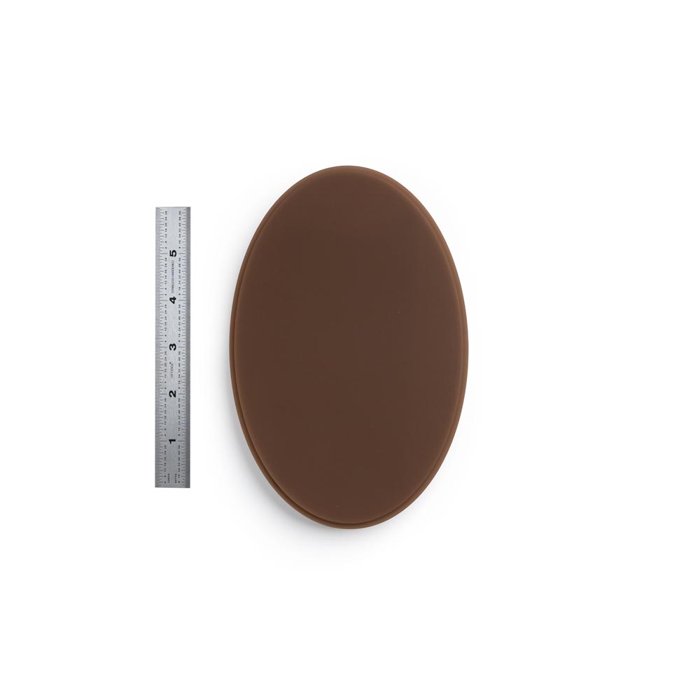 A Pound of Flesh Micro Series Tattooable Synthetic Small Oval in Fitzpatrick Tone 5 shown with six inch ruler for scale