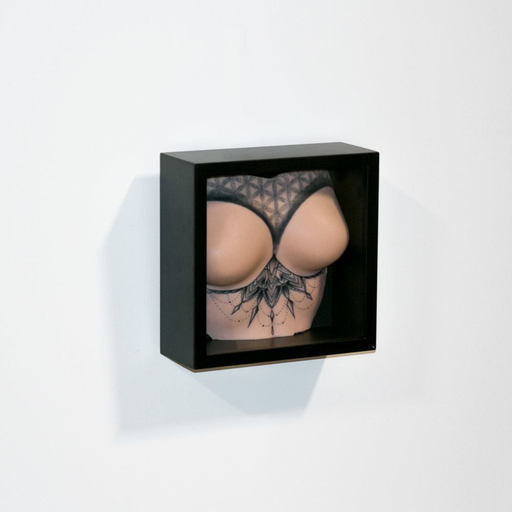 A Pound of Flesh Tattooable Synthetic Breasts with Torso — Tattooed Model Hanging Display